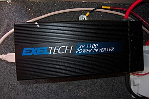 Exeltech XP 1100 inverter converts DC to AC when not connected to shore power; true sine-wave inverter provides AC to every appliance in the RV.