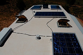 4 solar panels, (1) 130 watt Kyocera solar panel and (3) 120 watt Mitsubishi solar panels on the roof of the RV