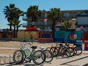 Bicycle rentals and bikes lined up on Mission Beach San Diego California