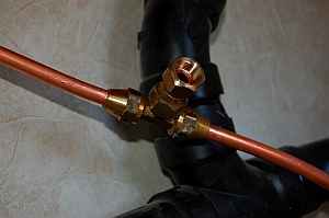 Female-female connector allows for male-male valve to control gas to the vent-free propane heater in our RV