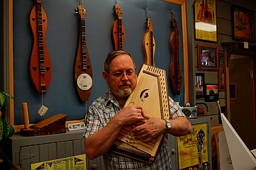 Playing autoharp at The Dulcimer Shoppe, Mountain View, AR