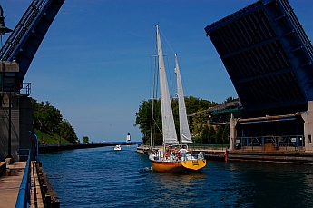 Charlevoix, Michigan lighthouse sailboat and drawbridge