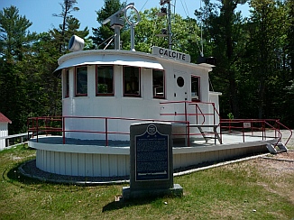 Forty Mile Point Lighthouse Michigan freighter Calcite