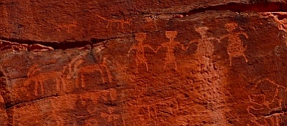 Petroglyph rock art, people holding hands and two big horn sheep