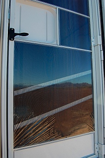 Shrink-wrapped screen door