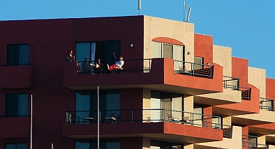 Crew of It's OK looks out over Hotel Coral & Marina