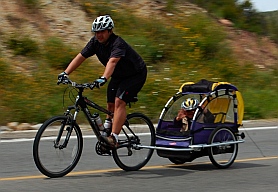 Kid in a Burley trailer