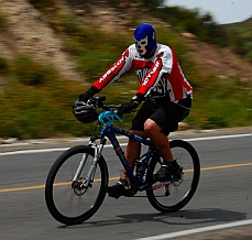 Cyclist in a wrestling mask
