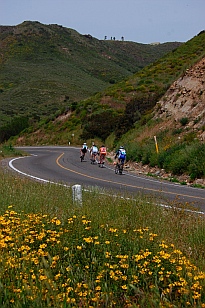 Cyclists sweep around a grand descent