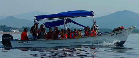 Kids on a boat in Chamela Bay.