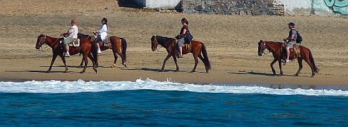 Horseback riding on Playa Miramar Bahia Santiago, Colima, Mexico