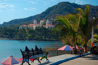 Barra de Navidad entrance channel pier, Jalisco, Mexico with Grand Bay Resort behind.