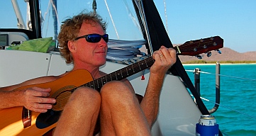 Mark plays guitar on sv Groovy at Puerto Balandra (Playa Balandra) outside La Paz, Baja California Sur, Sea of Cortez, Mexico