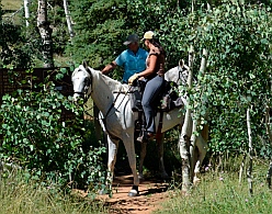 Horses and riders at trailhead for Cascade Falls hike, Dixie National Forest, Utah