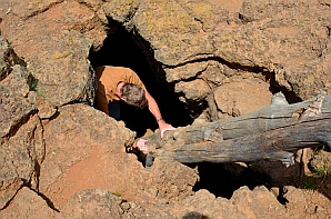 Climbing into Bowers Cave, Dixie National Forest, Utah