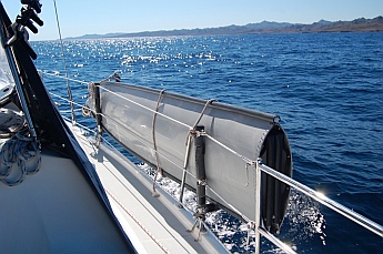 Porta-bote hull mounted outboard of Groovy's starboard deck.