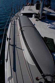 Porta-bote hull is carried to Groovy's forward deck for assembly.
