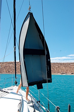 Porta-bote is hoisted on spare halyard.