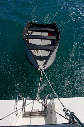 Painter is tied at two points on Groovy's transom to create a 3-point bridle. A second line is tied to Groovy's transom "just in case."