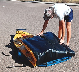 Putting away the Hobie i14t inflatable tandem kayak - fold it in thirds