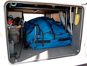 Hobie i14t inflatable tandem kayak takes up most of the space in a fifth wheel basement