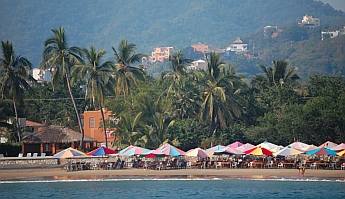 Beach palapas on Playa La Boquita, Santiago, Mexico