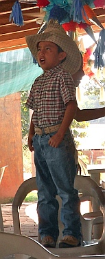 A young boy in Johnny's Taco Shop sings for us, Cihuatlan, Mexico