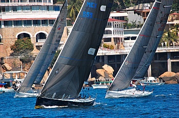 Racing yachts barrel down Boca Chica Channel.