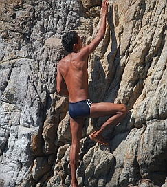 Cliff Diver Alejandro scales the rocks in La Quebrada.